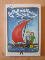 Ein Floss mit Mast und Segel.