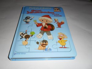 gebrauchtes Buch – Puzzlebuch "Unser Sandmännchen und seine Freunde"