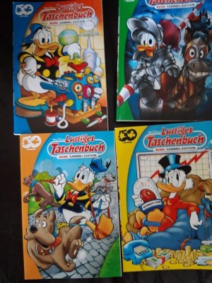 gebrauchtes Buch – 50 Jahre Rewe lustiges Taschenbuch Sammeledition -orange – Walt Disney lustiges Taschenbuch Rewe Sammeledition -orange