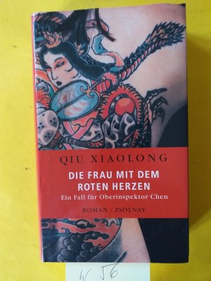 gebrauchtes Buch – Xiaolong Qiu  – " Die Frau mit dem roten Herzen " Ein Fall für Oberinspektor Chen.