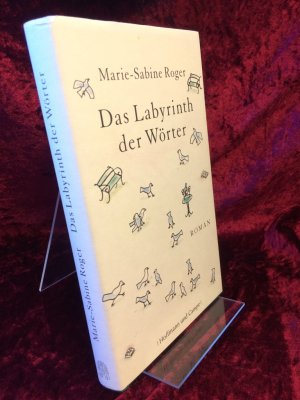 gebrauchtes Buch – Marie-Sabine Roger – Das Labyrinth der Wörter. Roman. Aus dem Französischen von Claudia Kalscheuer.