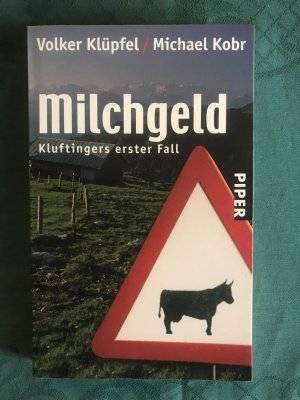 gebrauchtes Buch – Klüpfel, Volker; Kobr, Michael – Milchgeld - Kluftingers erster Fall | Kluftinger ermittelt