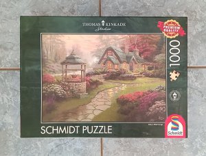 1000 Teile Puzzle von Thomas Kinkade - Haus mit Brunnen