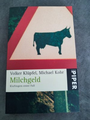 gebrauchtes Buch – Klüpfel, Volker; Kobr, Michael – Milchgeld - Kluftingers erster Fall | Kluftinger ermittelt