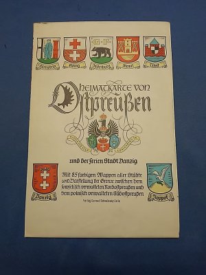 Heimatkarte von Ostpreußen und der freien Stadt Danzig Mit 85 farbigen Wappen aller Städte und Darstellung der Grenze zwischen dem sowjetisch verwalteten Nordostpreußen und dem polnisch verwalteten Südostpreußen.