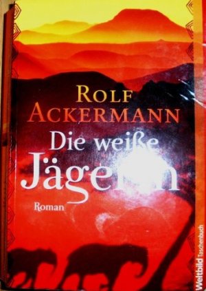 gebrauchtes Buch – Rolf Ackermann – Die weiße Jägerin : [Roman]. WeltbildTaschenbuch