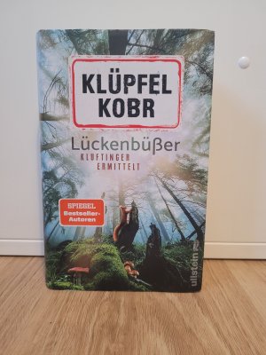 gebrauchtes Buch – Klüpfel, Volker; Kobr, Michael – Lückenbüßer (Kluftinger-Krimis 13) - Kluftinger ermittelt | Klufti isch bäck!