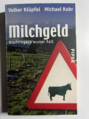 gebrauchtes Buch – Volker Klüpfel – Milchgeld - Kluftingers großer Fall