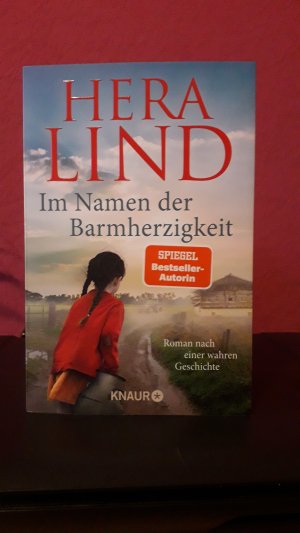 gebrauchtes Buch – Hera Lind – Im Namen der Barmherzigkeit - Roman nach einer wahren Geschichte