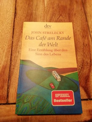 gebrauchtes Buch – John Strelecky – Das Café am Rande der Welt - Eine Erzählung über den Sinn des Lebens