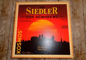 gebrauchtes Spiel – Klaus Teuber – Die Siedler von Nürnberg - ab 10 J. - KOSMOS **WIRKT UNBESPIELT**