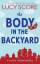 Lucy Score: The Body in the Backyard