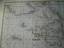 antiquarisches Buch – Mortier Pierre – Carte Generale Des Costes De L'Europe Sur L'Ocean Comprises depuis Drontheim en Norvege Jusques au Detroit de Gibraltar. Levée et Gravée par Ordre du Roy à Paris 1693. 1693 (dated)     23.5 x 33.5 in (59.69 x 85.09 cm)      A stunning elephant folio nautical chart or maritime map of the western European coast issued in 1693 by Pierre Mortier and Alexis Hubert Jaillot. Oriented to the west and centered on the British Isles, the chart covers from Trondheim (Dronthem), Norway to Cape Cantin, Morocco, extending eastward as far as Denmark and Holstein, and westward to include the southern coast of Iceland. While there is limited inland detail, as is typical of maritime charts, the coastlines are richly detailed with countless ports, banks, and other geographical features noted. Depth soundings appear along some of the better-known coasts, particularly in the English Channel and North Sea. Deeply engraved rhumb lines crisscross the chart throughout.  Cartographically Mortier derived this map from an earlier map issued by Charles Pène for the prototype edition of the Neptune François. Mortier re-engraved the original plates with greater precision and detail, updating them somewhat, to issue in his 1693 Amsterdam edition of Le Neptune François, considered one of the largest and finest nautical atlases of the 17h century. CartographerS  Pierre Mortier (1661 - 1711) or Pieter Mortier was a cartographer, engraver, and print seller active in Amsterdam during the later 17th and early 18th centuries. Mortier, then known as Pieter, was born in Leiden. He relocated to Paris from 1681 to 1685, adopting the French name Pierre, which he retained throughout his career. There is developed deep French connections by bringing sophisticated Dutch printing technology and experience to nascent French map publishers such as De L'Isle, Sanson, Jaillot, de Fer and De Wit. Consequently, much of Mortier's business was built upon issuing embellished high quality editions of contemporary French maps. In the greater context of global cartography, this was a significant advantage as most Dutch map publishes had, at this point, fallen into the miasma of reprinting their own outdated works. By contrast, the cartographers of France were producing the most accurate and up to date charts anywhere. Mortier's cartographic work culminated in the magnificent nautical atlas, Le Neptune Francois. H was awarded the Privilege, an early form of copyright, in 1690. Upon Pierre's death in 1711 this business was inherited by his widow. In 1721, his son Cornelius Mortier took over the day to day operation of the firm. Cornelius partnered with his brother-in-law Jean Covens to form one of history's great cartographic partnerships - Covens and Mortier - which continued to publish maps and atlases until about 1866.  Alexis-Hubert Jaillot (c. 1632- 1712) followed Nicholas Sanson (1600 - 1667) and his descendants in ushering in the great age of French Cartography in the late 17th and 18th century. The publishing center of the cartographic world gradually transitioned from Amsterdam to Paris following the disastrous inferno that destroyed the preeminent Blaeu firm in 1672. Hubert Jaillot was born in Franche-Comte and trained as a sculptor. When he married the daughter of the enlumineur de ala Reine, Nicholas Berey, he found himself positioned to inherit a lucrative map and print publishing firm. When Nicholas Sanson, the premier French cartographer of the day, died Jaillot negotiated with his heirs to republish much of Sanson's work. Though not a cartographer himself, Jaillot's access to the Sanson plates enabled him to publish numerous maps and atlases with only slight modifications and updates to the plates. As a sculptor and an artist, Jaillot's maps were particularly admired for their elaborate and meaningful allegorical cartouches and other decorative elements. Jaillot used his allegorical cartouche work to extol the virtues of the Sun King Louis IV, and his military and political triumphs. These earned him the patronage of the French crown who used his maps in the tutoring of the young Dauphin. In 1686 he was awarded the title of Geographe du Roi, bearing with it significant prestige and the yearly stipend of 600 Livres. Jaillot was one of the last French map makers to acquire this title. Louis XV, after taking the throne, replaced the position with the more prestigious and singular title of Premier Geographe du Roi. Jaillot died in Paris in 1712. His most important work was his 1693 Le Neptune Francois. Jalliot was succeed by his son, Bernard-Jean-Hyacinthe Jaillot (1673 - 1739), grandson, Bernard-Antoine Jaillot (???? – 1749) and the latter's brother-in-law, Jean Baptiste-Michel Renou de Chauvigné-Jaillot (1710 - 1780). Condition Very good. Printed on thick paper, wide margins, contemporary colours in outline. – Bild 3